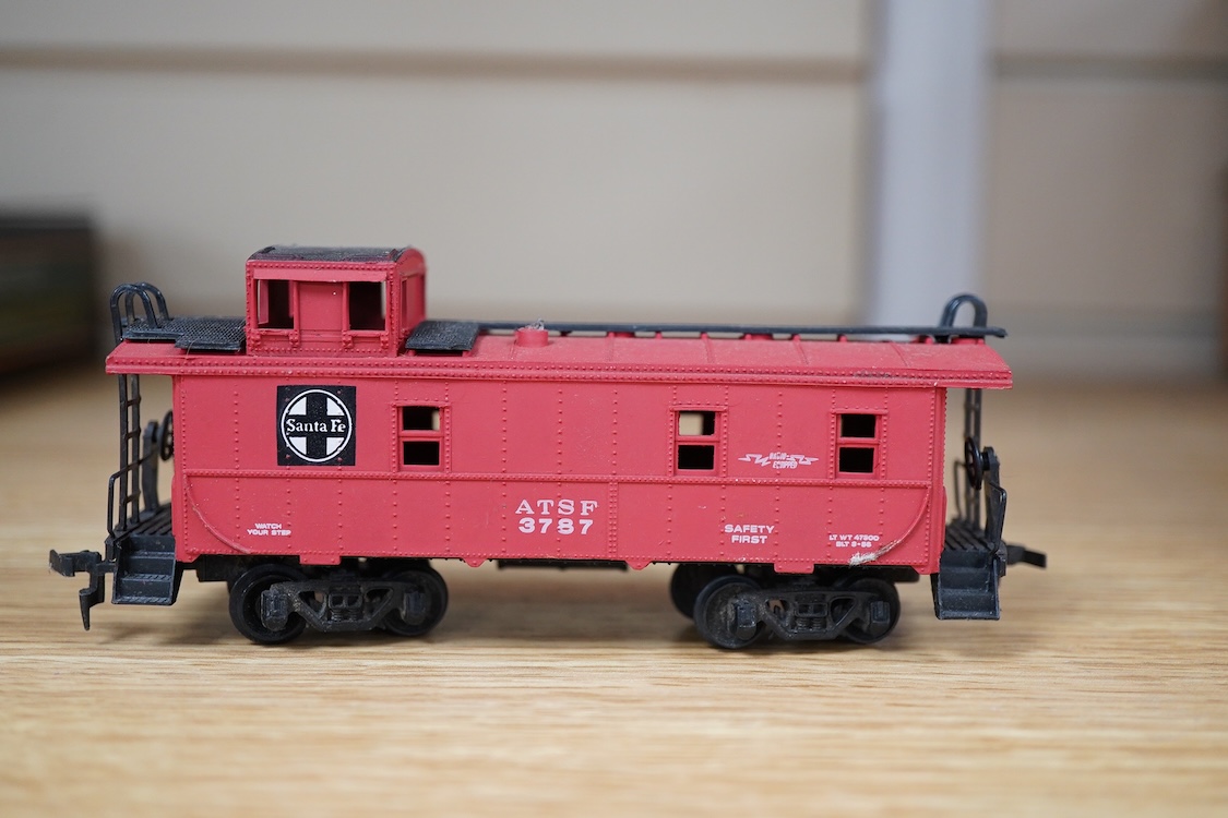 A quantity of US outline HO railway by Athearn, Bachmann, etc. including three locomotives; a Union Pacific Bo-Bo diesel, 1468, a Santa Fe Bo-Bo diesel, 5707, and a Santa Fe 0-4-0 tender engine, together with a 12-wheel